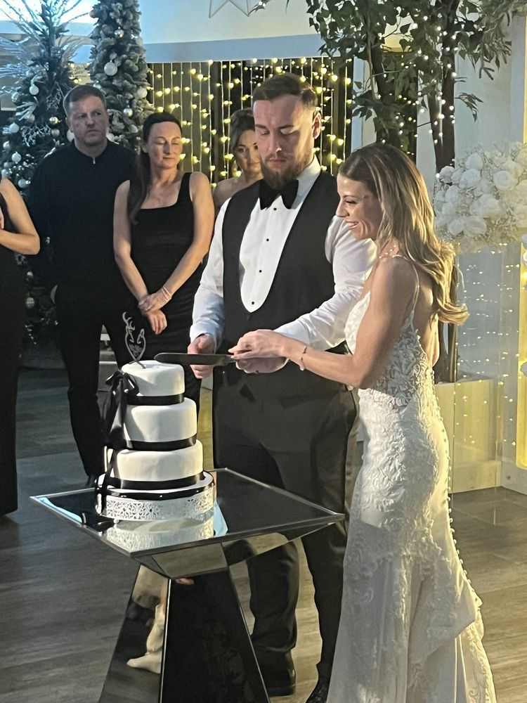 Bride and groom cutting their wedding cake